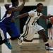 Father Gabriel Richard senior Ashton Hundley drives against a Pioneer defender on Tuesday. Daniel Brenner I AnnArbor.com